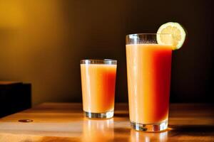 Glass of fresh mango juice on wooden table, closeup. Healthy food concept. photo