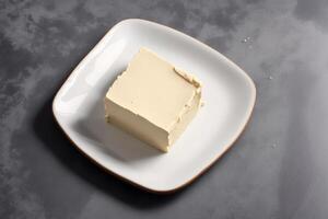 Fresh butter on a plate, close-up. photo