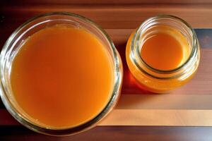 Honey in a glass jar on a wooden background. Selective focus. healthy food concept. photo