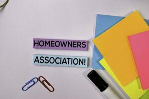 Homeowners Association on sticky notes isolated on white background. photo