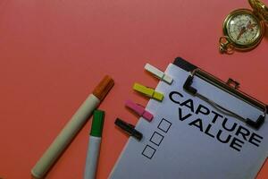 Capture Value write on Documents isolated on Pink background. photo