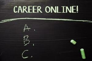 Career Online written with color chalk. Supported by an additional services. Blackboard concept photo