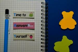 TRY - Time to Reinvent Yourself write on sticky notes isolated on Office Desk photo