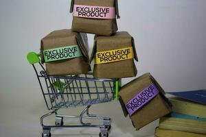 Exclusive Product Text in small boxes and shopping cart. Concepts about online shopping. Isolated on white background photo