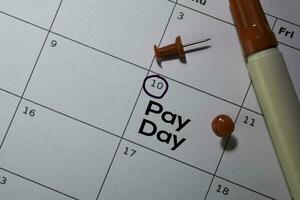 Pay Day write on calendar. Date 10. Reminder or Schedule Concepts photo