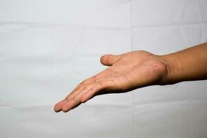 Close up Asian man shows hand gestures it means Look at that isolated on white background photo