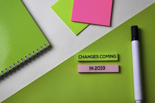 Changes coming in 2019 text on top view office desk table of Business workplace and business objects. photo