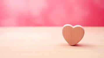 A red heart on the wooden with pink background love concept. photo