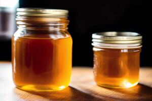 Honey in a glass jar on a wooden background. Selective focus. healthy food concept. photo