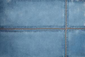 Grunge blue background with space for your text or image. Blue jeans background. photo