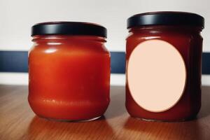 Strawberry jam in a glass jar with fresh strawberries, closeup. Healthy food concept. photo