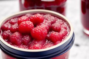 Raspberry jam in glass jars on a white background. Selective focus. photo