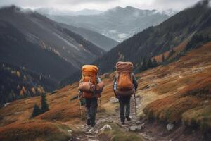 Travelers with backpacks hiking in mountains. photo