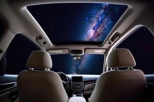 Car interior with space galaxy background. photo