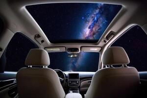Car interior with space galaxy background. photo
