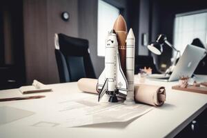 Successful startup concept. Launching rocket on office table. photo