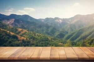 Empty wooden table with blurred mountain landscape background. photo