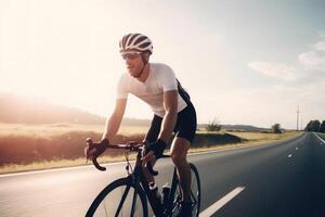 Professional cyclist in protective helmet trains on road. photo