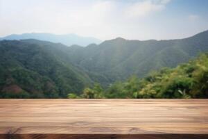 Empty wooden table with blurred mountain landscape background. photo