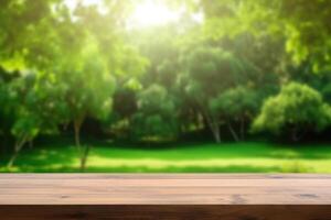 Empty wooden table with blurred natural green background. photo