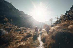 Travelers with backpacks hiking in mountains. photo