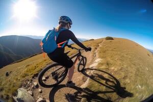 Professional cyclist in protective helmet trains on mountain road. photo