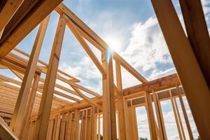 New house construction. Wooden frame with truss, post and beams. photo