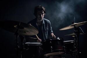 Musician plays drums, drummer on dark background. photo