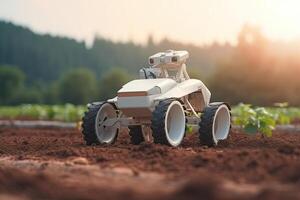 Unmanned robot working in agricultural field. photo