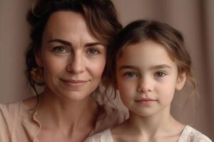 Mother and daughter portrait on pastel background. photo