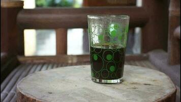 black coffee with transparent glass cup. video