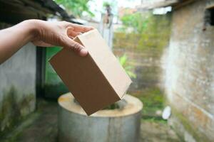 blank brown cardboard photo with hand