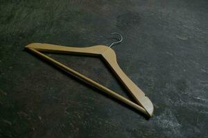 Photo of a wooden clothes hanger on the floor