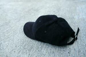 black hat photo on the floor