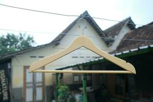 Photo of a wooden clothes hanger on a hanger