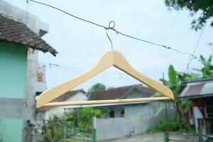 Photo of a wooden clothes hanger on a hanger