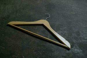 Photo of a wooden clothes hanger on the floor