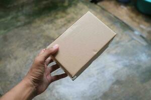 blank brown cardboard photo with hand