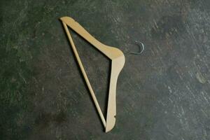 Photo of a wooden clothes hanger on the floor