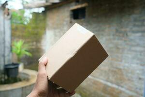 blank brown cardboard photo with hand