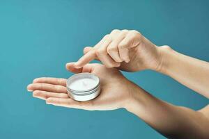 cream in hands skin care close-up dermatology health photo