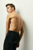 male topless standing back black pants posing fashion luxury photo