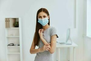 young woman with germicidal plaster on shoulder in hospital immunity covid passport photo