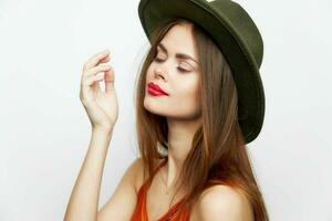 Portrait of a woman in a hat Closed eyes hand near face attractive look photo