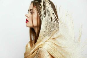 A lady with a shawl Looks aside the charm of luxury makeup photo