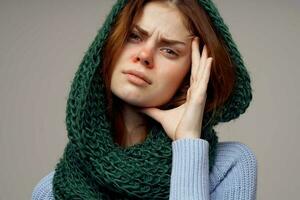 red-haired woman green scarf on the head isolated background photo