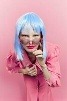 portrait of a woman in blue wig pink dress red lips Lifestyle posing photo