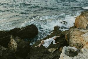 Beautiful bride in white wedding dress on sea shore wet hair vacation concept photo