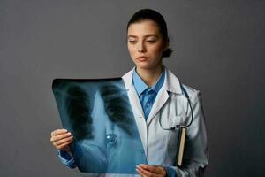 female doctor x-ray take a follow-up gown health professional job photo