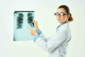 female doctor with glasses in white coat x-ray hospital photo